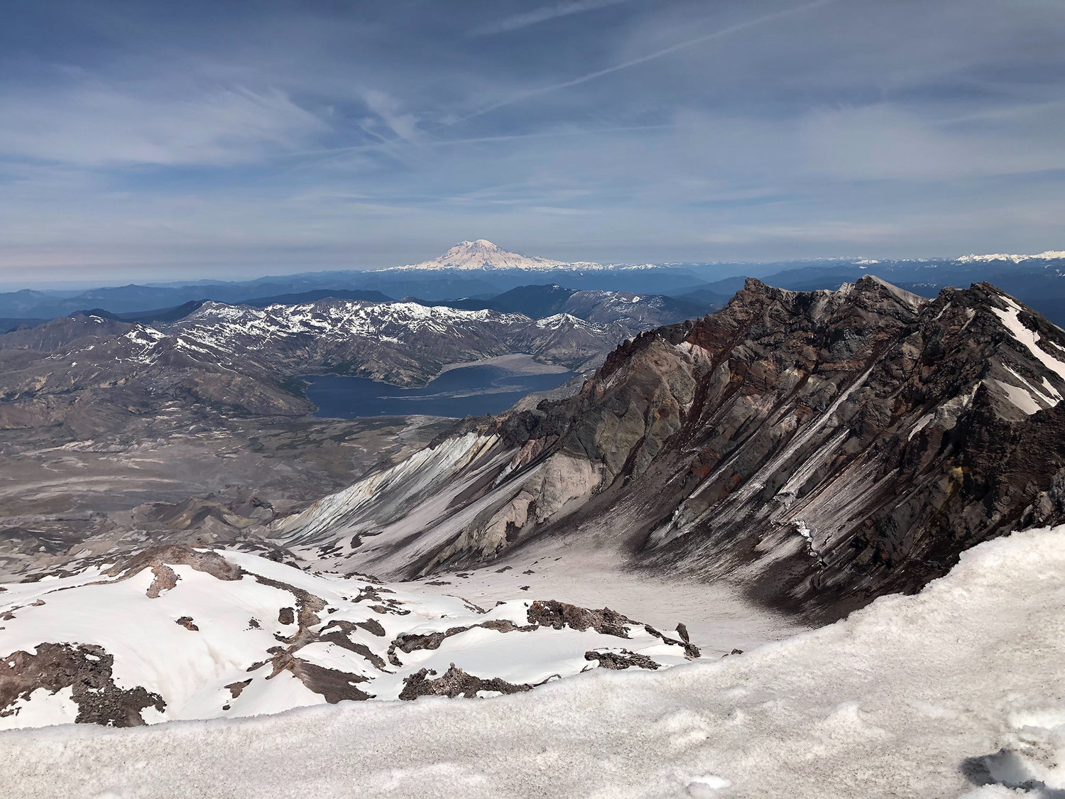 Mount Rainier and Spirit Lake are seen from the summit of Mount St. Helens in this May 2019 Chronicle file photo.
